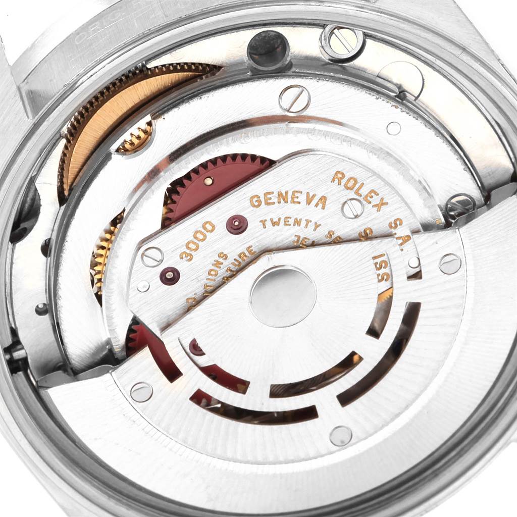 This image shows a close-up of the internal mechanism of a Rolex Air-King 14010 Men's Stainless Steel Silver Dial 14010 Men's Stainless Steel Silver Dial watch, highlighting parts such as gears and the rotor.