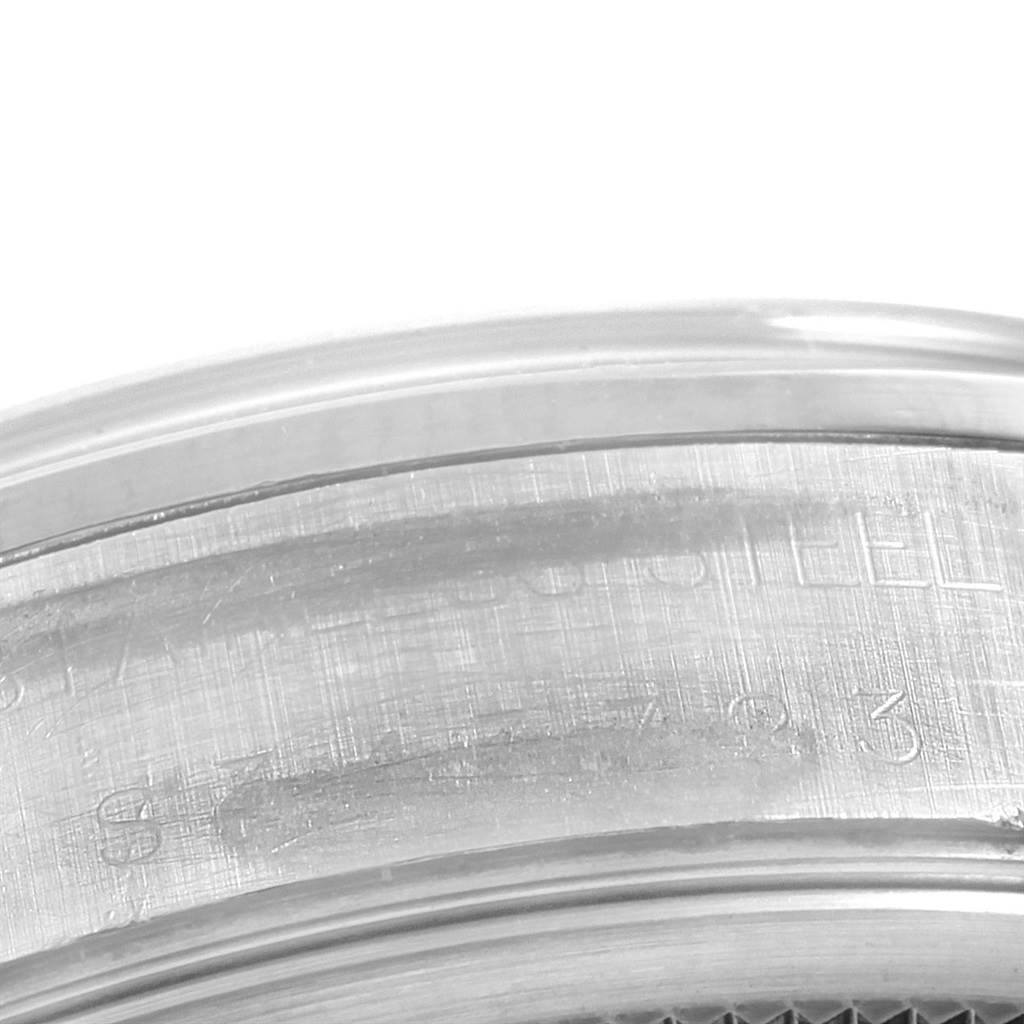The image shows a close-up of the side of the case of a Rolex Air-King 14000 Men's Stainless Steel Pink Dial 14000 Men's Stainless Steel Pink Dial, highlighting its engraving details.