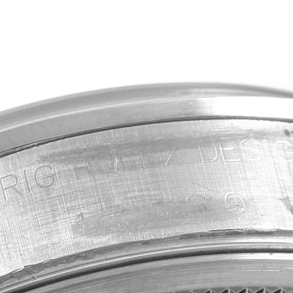 This image shows a close-up angle of the side of a Rolex Air-King 14000 Men's Stainless Steel Pink Dial 14000 Men's Stainless Steel Pink Dial watch, focusing on the engraved text.