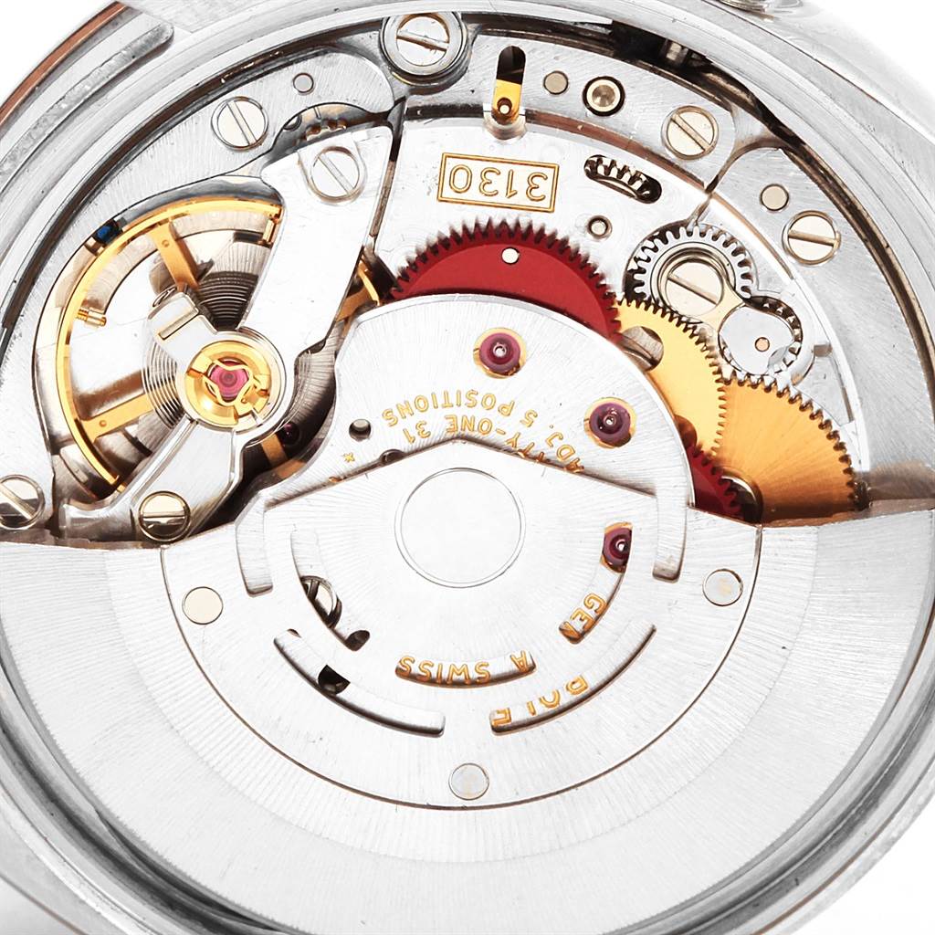 This is a close-up of the Rolex Air-King 114200 Men's Stainless Steel White Dial 114200 Men's Stainless Steel White Dial watch's internal mechanism, showcasing its intricate gears and components.