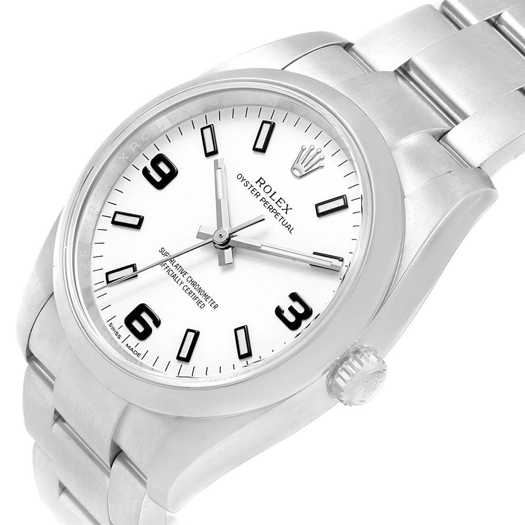 The image shows a close-up of a Rolex Air-King 114200 Men's Stainless Steel White Dial 114200 Men's Stainless Steel White Dial watch, focusing on the dial, bezel, and a portion of the metal bracelet from an angled side view.