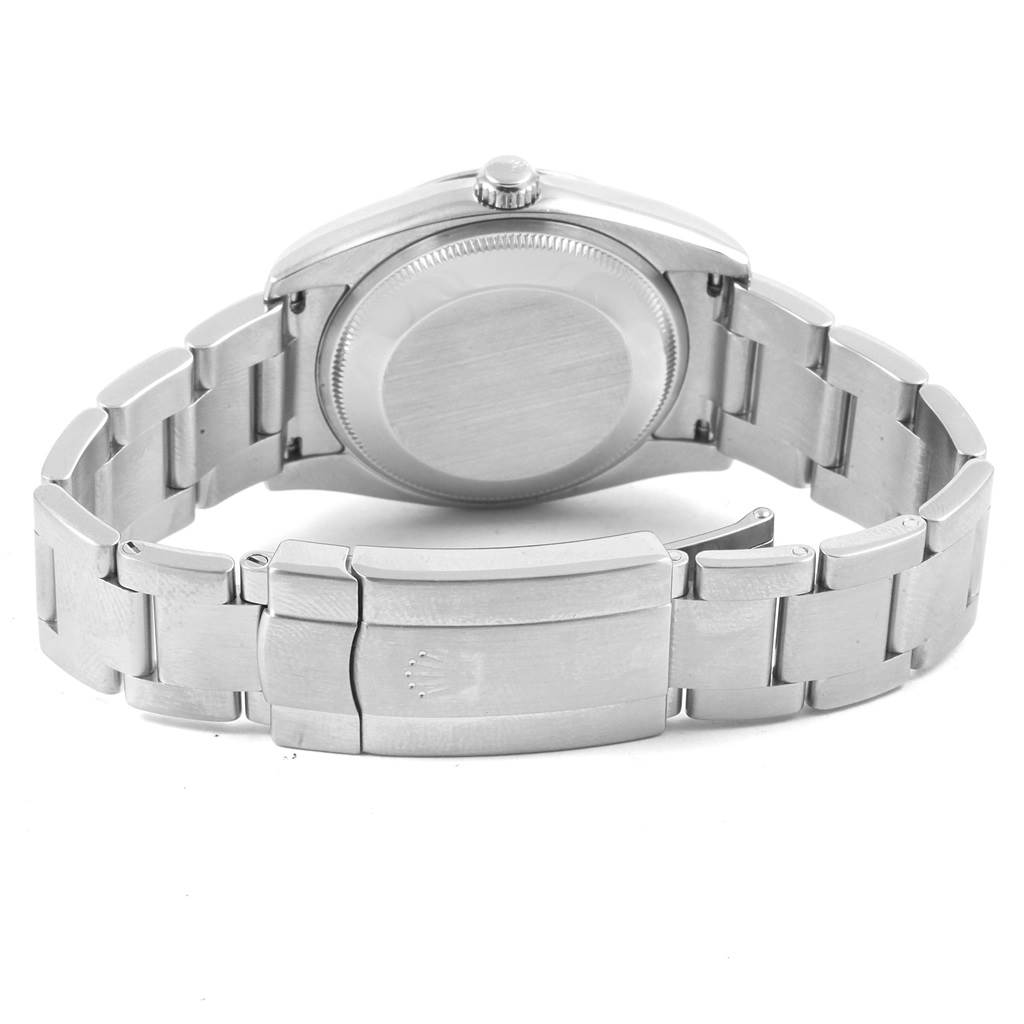 The image shows the back view of a Rolex Air-King 114200 Men's Stainless Steel White Dial 114200 Men's Stainless Steel White Dial watch highlighting the clasp and bracelet links.