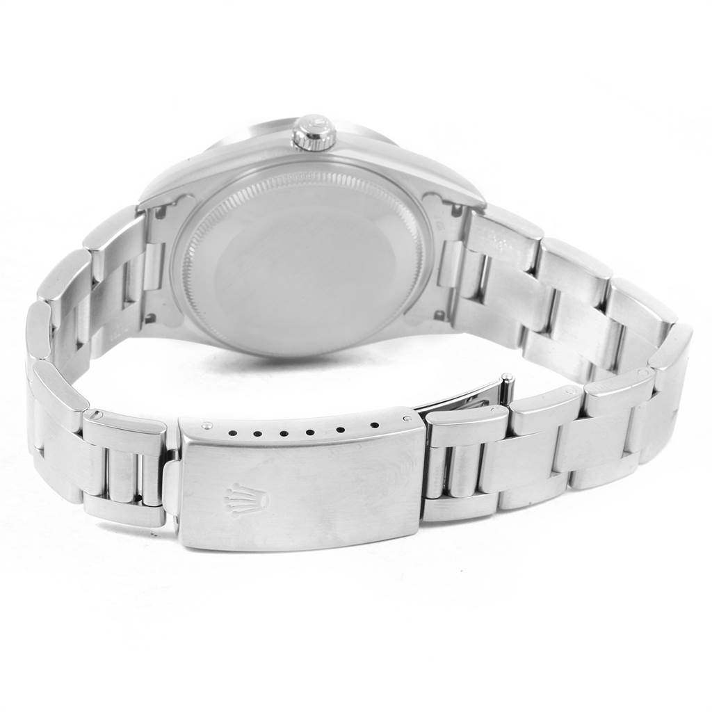 The image shows the back view and the bracelet of a Rolex Air-King 14010 Men's Stainless Steel Silver Dial 14010 Men's Stainless Steel Silver Dial watch, highlighting the clasp and screw-down case back.