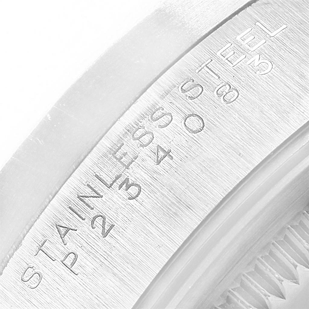 Close-up view of the inner bezel of a Rolex Air-King 14010 Men's Stainless Steel Silver Dial 14010 Men's Stainless Steel Silver Dial watch showing engraved details.