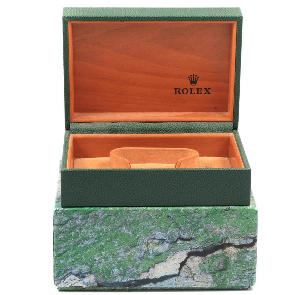 The image shows an open green Rolex box for the Air-King model, revealing the interior with a watch holder.