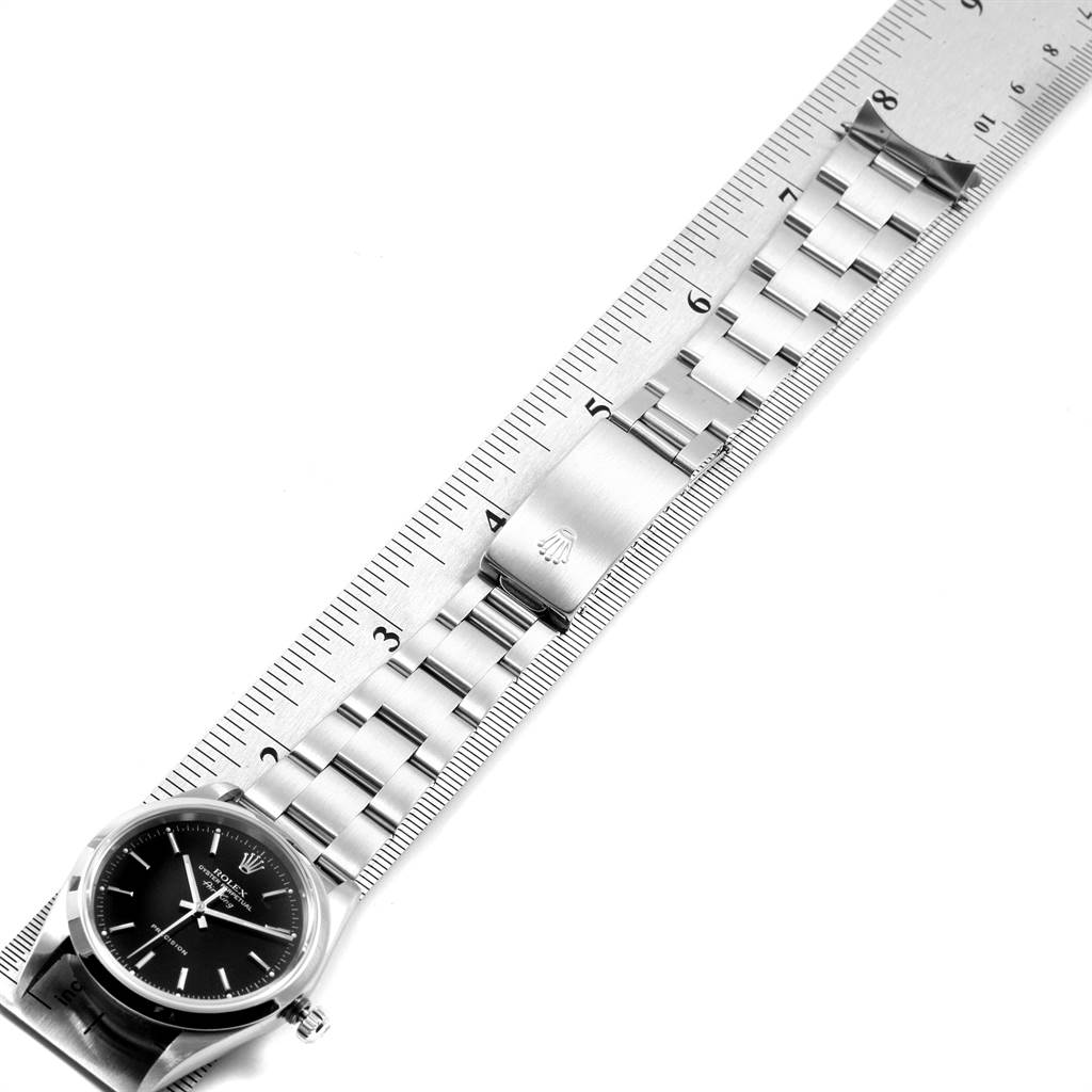 The image shows a Rolex Air-King 14000 Men's Stainless Steel Black Dial 14000 Men's Stainless Steel Black Dial watch laid flat alongside a ruler, highlighting its bracelet and clasp.