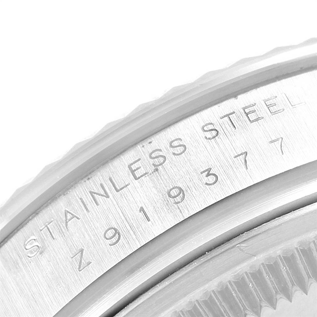The image shows a close-up of the stainless steel casing with engraving on the Rolex Air-King 114234 Men's Stainless Steel Blue Dial 114234 Men's Stainless Steel Blue Dial watch.