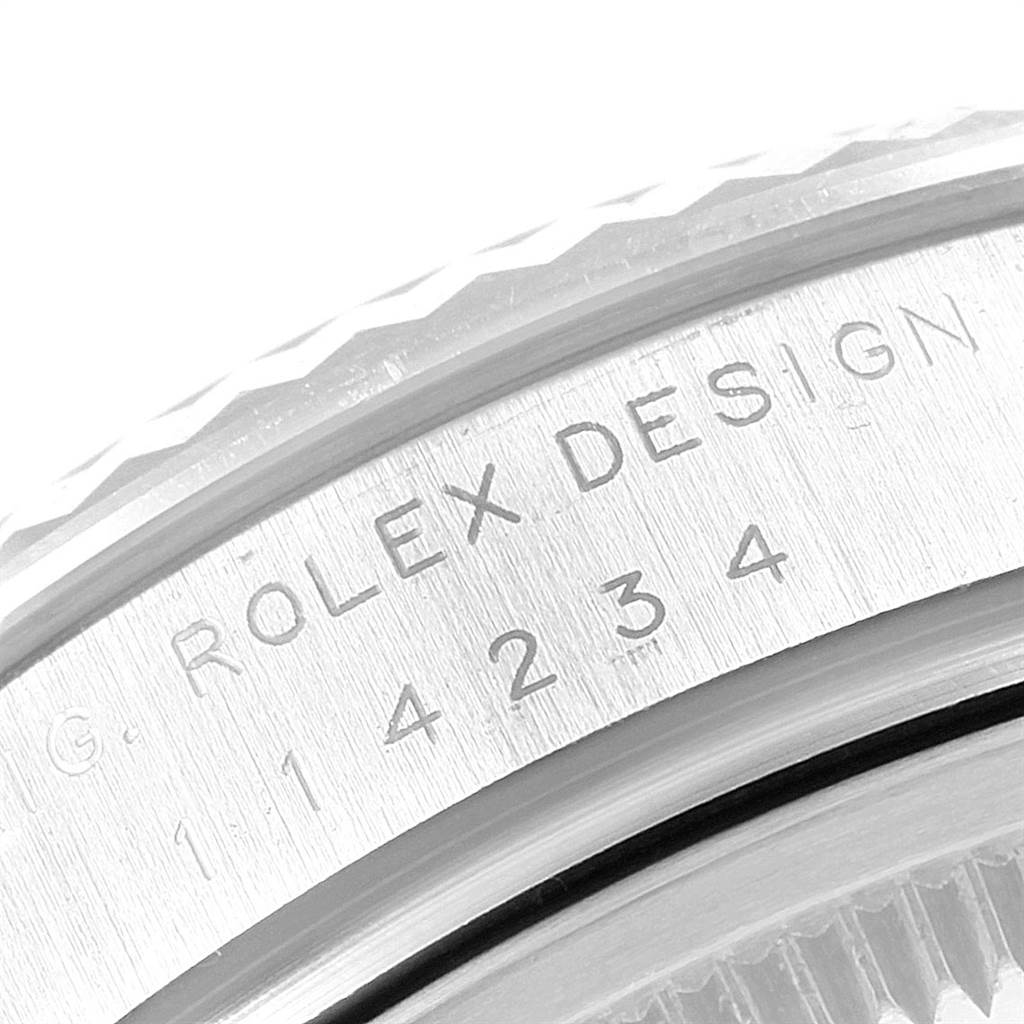 The image shows a close-up of the engraved case back of a Rolex Air-King 114234 Men's Stainless Steel Blue Dial 114234 Men's Stainless Steel Blue Dial watch displaying the serial and model numbers.