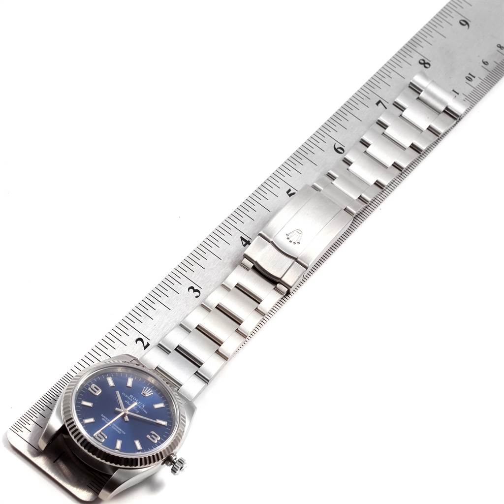 The image shows the Rolex Air-King 114234 Men's Stainless Steel Blue Dial 114234 Men's Stainless Steel Blue Dial watch at a flat angle with the full bracelet laid alongside a ruler.