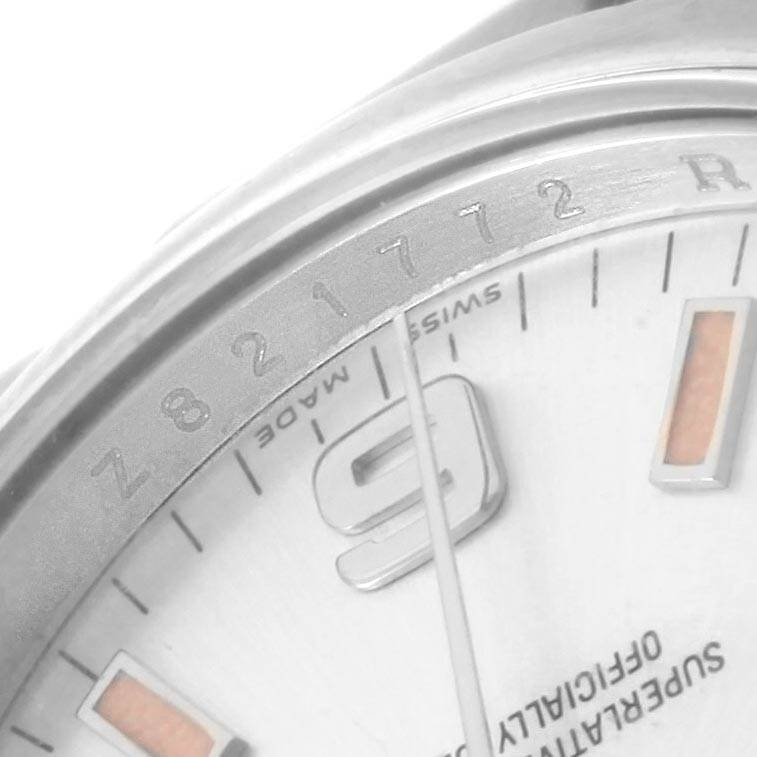The image shows a close-up angle of the dial and part of the bezel of a Rolex Air-King 114200 Stainless Steel Silver Dial 114200 Stainless Steel Silver Dial watch, focusing on the 9 o'clock marker and surrounding details.