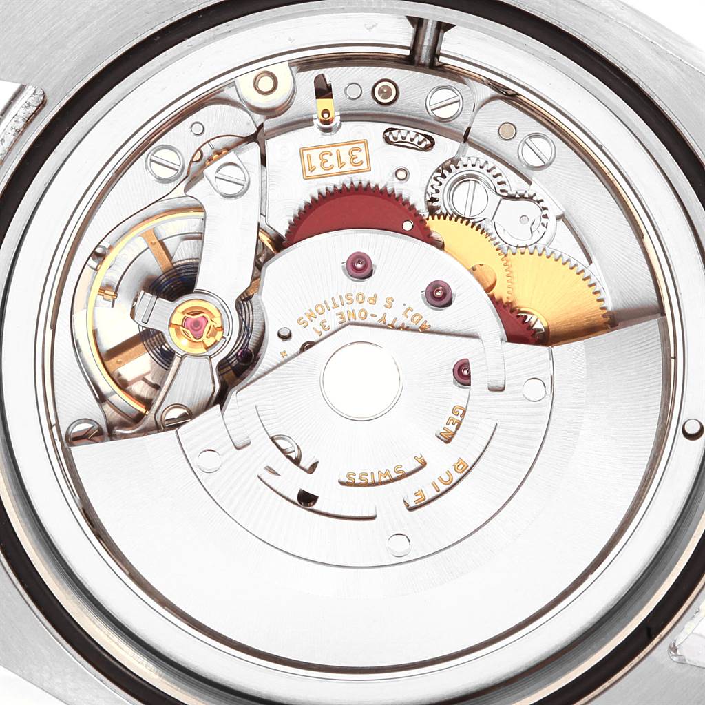 Close-up of the movement mechanism of the Rolex Air-King 116900 Men's Stainless Steel Black Dial 116900 Men's Stainless Steel Black Dial watch, showcasing gears and intricate components.