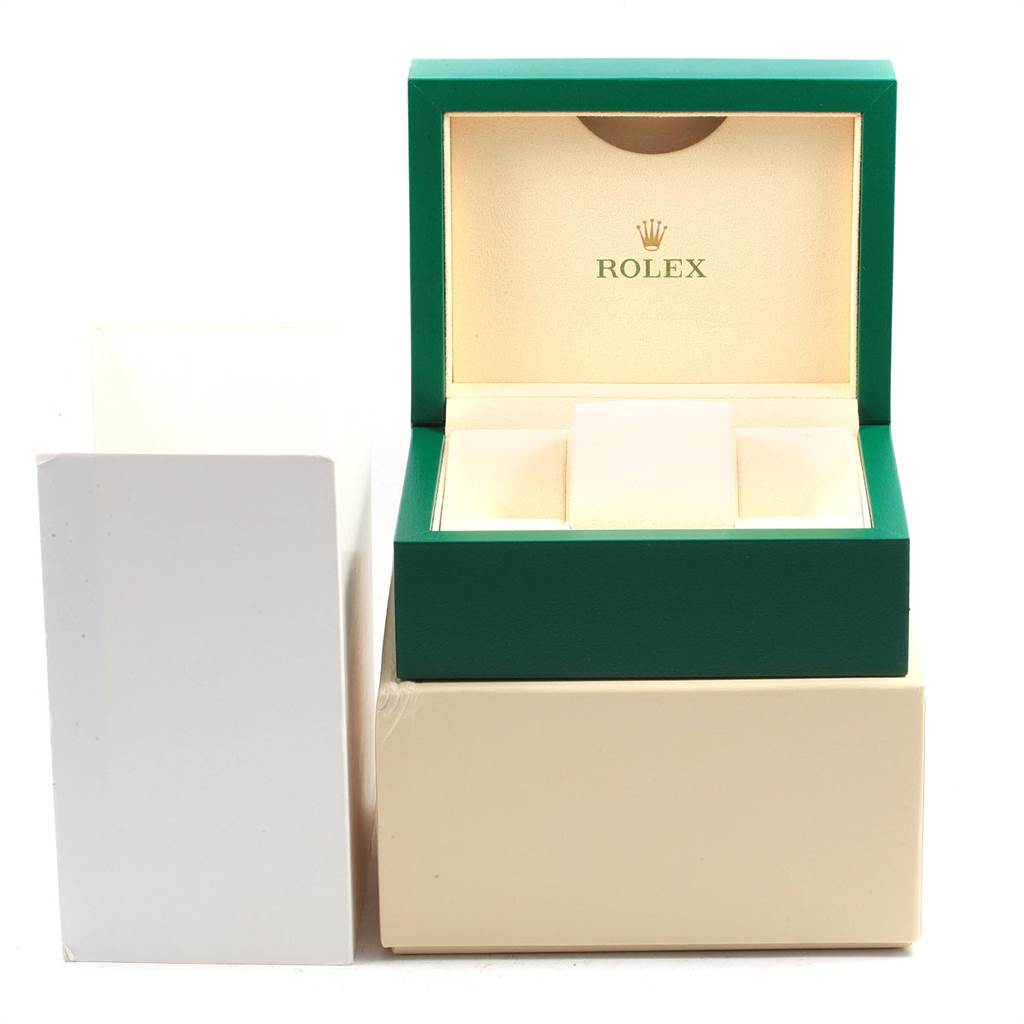 The image shows an open green box of a Rolex Air-King 116900 Men's Stainless Steel Black Dial 116900 Men's Stainless Steel Black Dial watch with its beige interior and surrounding packaging.