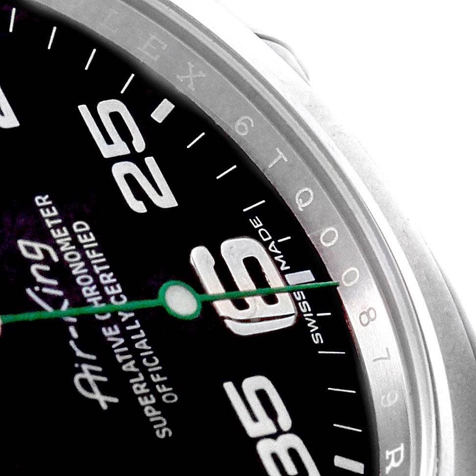 This close-up image shows the dial of a Rolex Air-King 116900 Men's Stainless Steel Black Dial 116900 Men's Stainless Steel Black Dial watch, focusing on the numerals, hands, and part of the bezel.