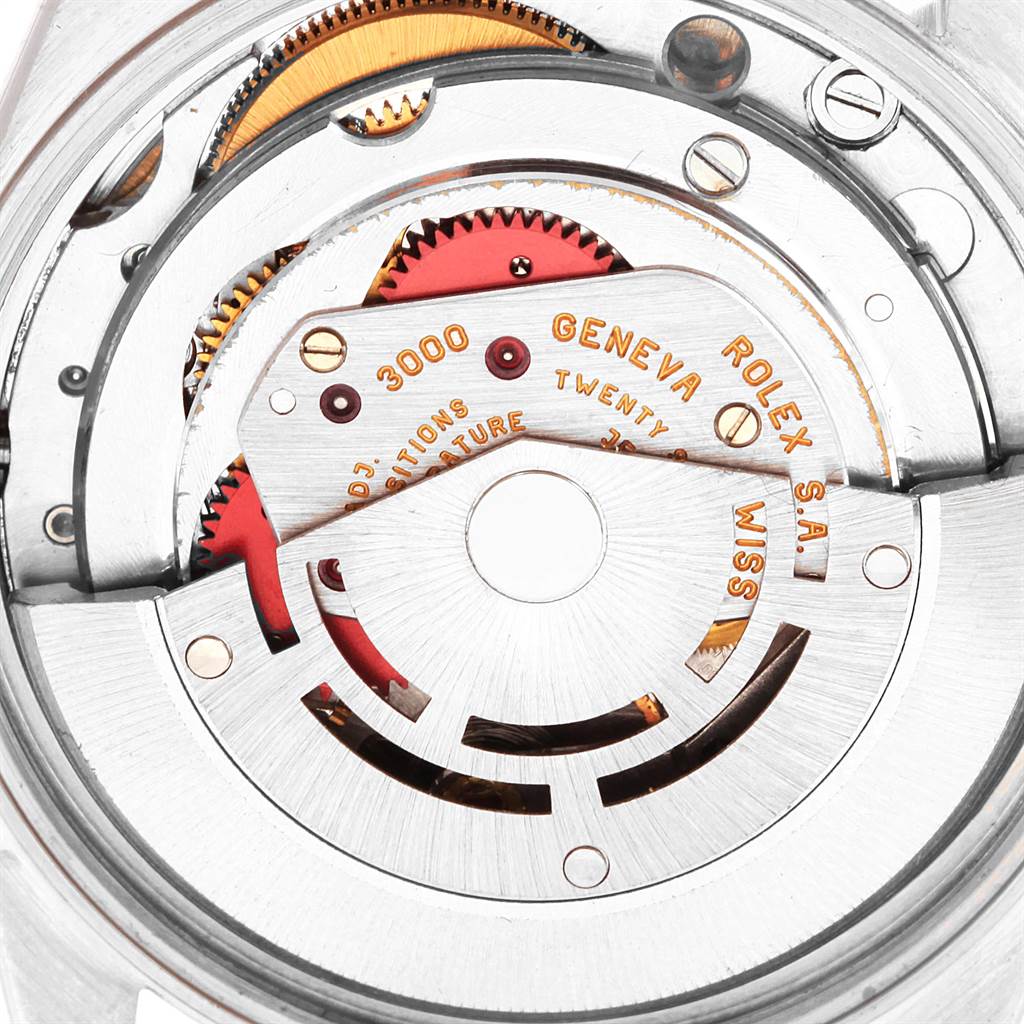 This image shows the intricate internal mechanism of a Rolex Air-King 14010 Men's Stainless Steel White Dial 14010 Men's Stainless Steel White Dial watch from a top-view angle, highlighting its gears and rotor.
