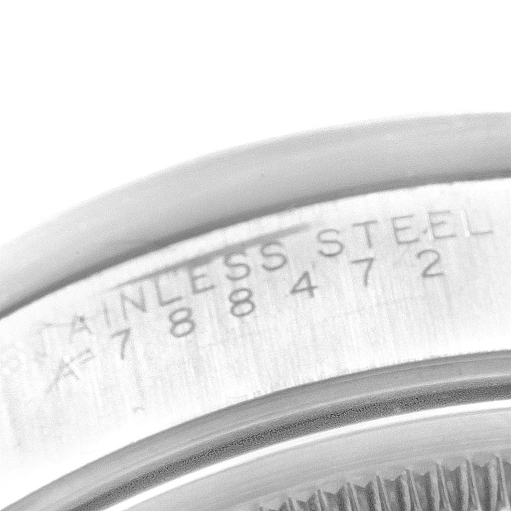This image shows a close-up of the stainless steel casing with serial numbers on a Rolex Air-King 14010 Men's Stainless Steel White Dial 14010 Men's Stainless Steel White Dial watch.