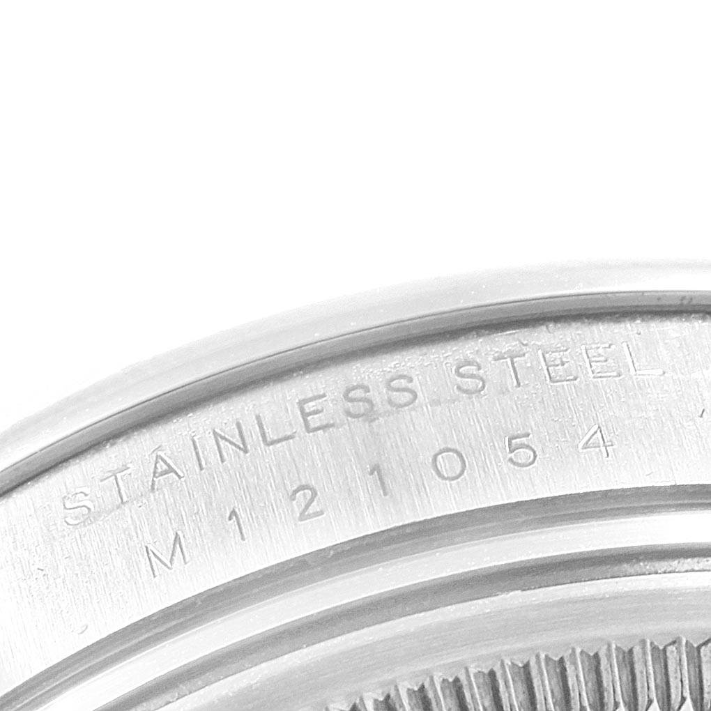 The close-up image shows the engraved serial number and "STAINLESS STEEL" marking on the Rolex Air-King 114200 Men's Stainless Steel Silver Dial 114200 Men's Stainless Steel Silver Dial watch caseback.