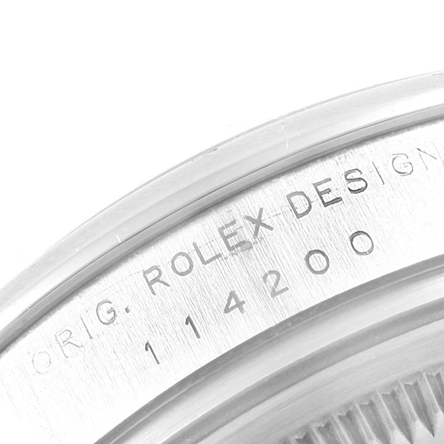 The image shows a close-up of the case back of a Rolex Air-King 114200 Men's Stainless Steel Silver Dial 114200 Men's Stainless Steel Silver Dial watch, highlighting the engraved model number 114200.