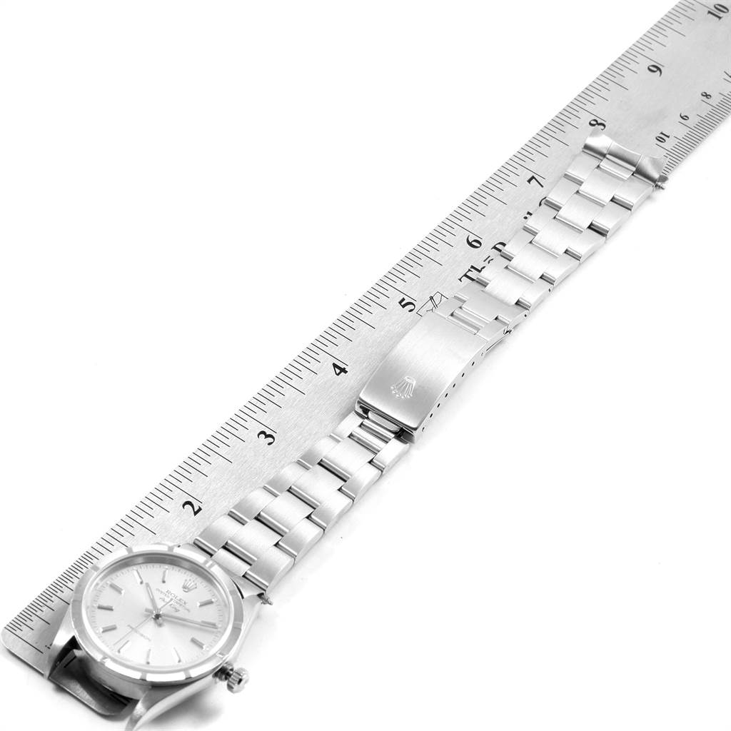 The image shows a Rolex Air-King 14010 Men's Stainless Steel Silver Dial 14010 Men's Stainless Steel Silver Dial watch laid flat next to a ruler for scale, displaying the bracelet and clasp.