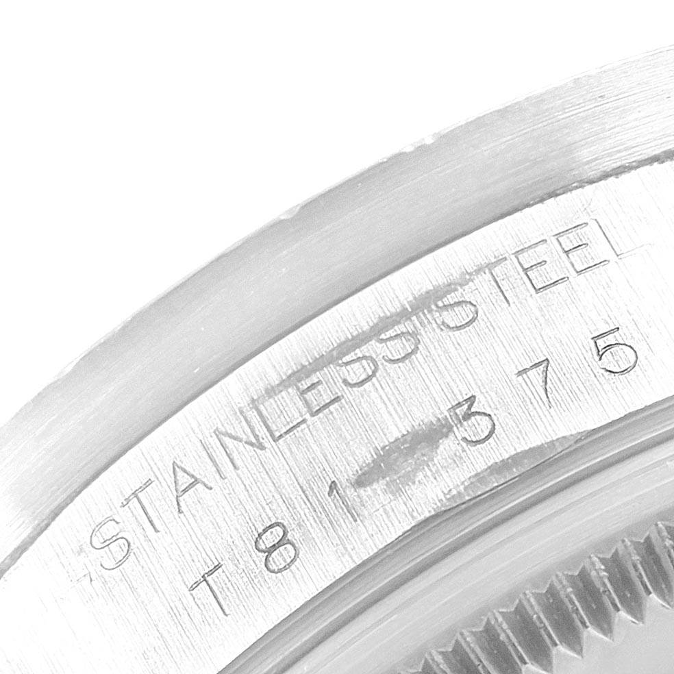 The image shows a close-up of the stainless steel case back and serial number on a Rolex Air-King 14010 Men's Stainless Steel Silver Dial 14010 Men's Stainless Steel Silver Dial watch.