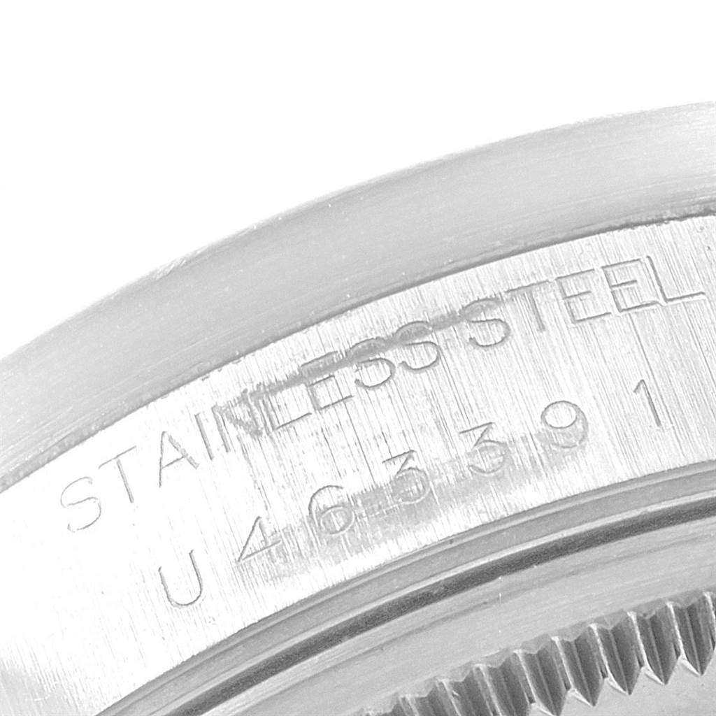 The image shows a close-up of the case back edge of a Rolex Air-King 14010 Men's Stainless Steel Silver Dial 14010 Men's Stainless Steel Silver Dial watch, displaying the model number and "STAINLESS STEEL" engraving.