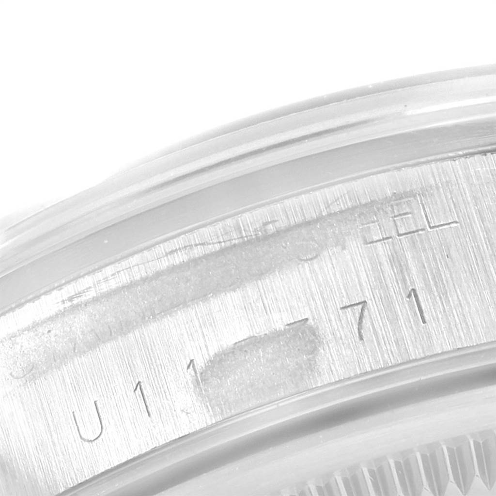 This image shows an extreme close-up of the engravings on the side of a Rolex Air-King 14000 Men's Stainless Steel Blue Dial 14000 Men's Stainless Steel Blue Dial watch case.