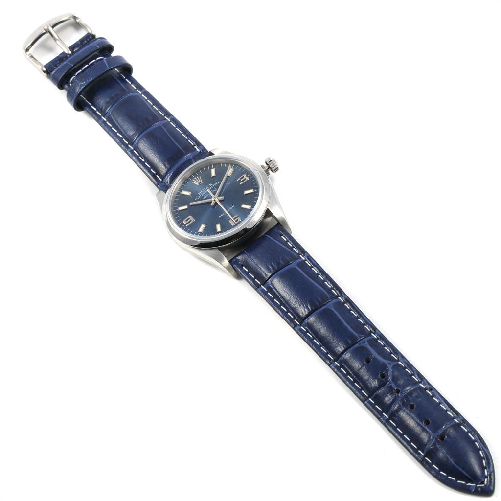 The Rolex Air-King 14000 Men's Stainless Steel Blue Dial 14000 Men's Stainless Steel Blue Dial watch is shown from a top-down angle, highlighting its face, case, and blue leather strap.