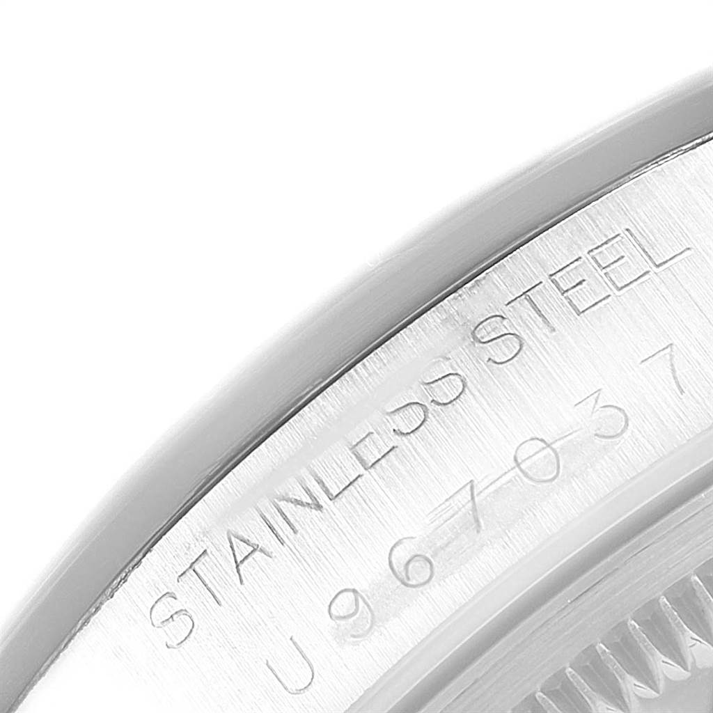 The image shows an angled close-up of the engraved back of the Rolex Air-King 14000 Men's Stainless Steel Black Dial 14000 Men's Stainless Steel Black Dial watch, displaying "STAINLESS STEEL" and a serial number.