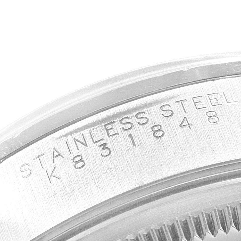 This image showcases a close-up of the side of a Rolex Air-King 14000 Men's Stainless Steel Black Dial 14000 Men's Stainless Steel Black Dial watch, focusing on the stainless steel casing with its engraved serial number.