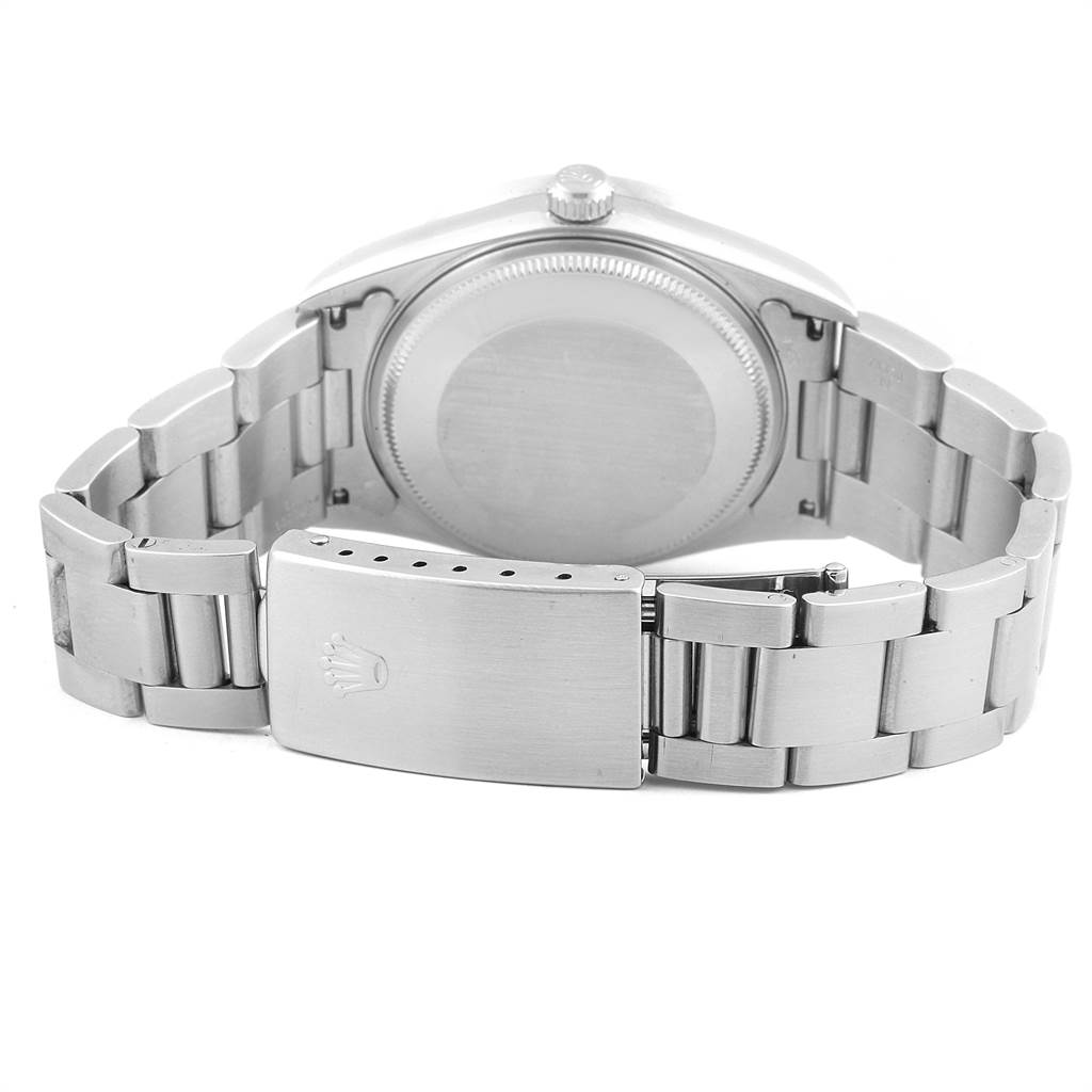 The image shows the back view of a Rolex Air-King 14010 Men's Stainless Steel Silver Dial 14010 Men's Stainless Steel Silver Dial watch, featuring its clasp, bracelet, and case back.