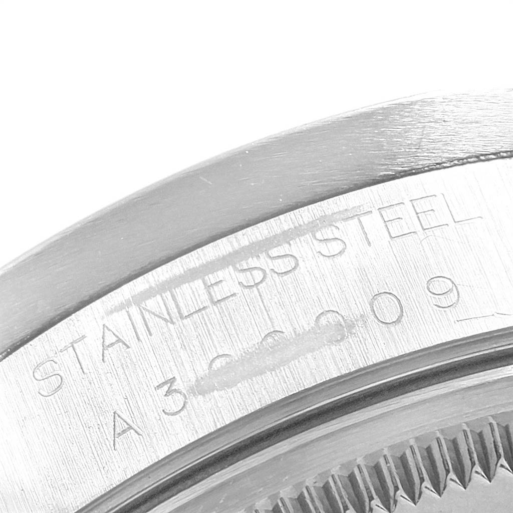 The image shows a close-up of the edge and engravings on the stainless steel casing of a Rolex Air-King 14010 Men's Stainless Steel Silver Dial 14010 Men's Stainless Steel Silver Dial watch.
