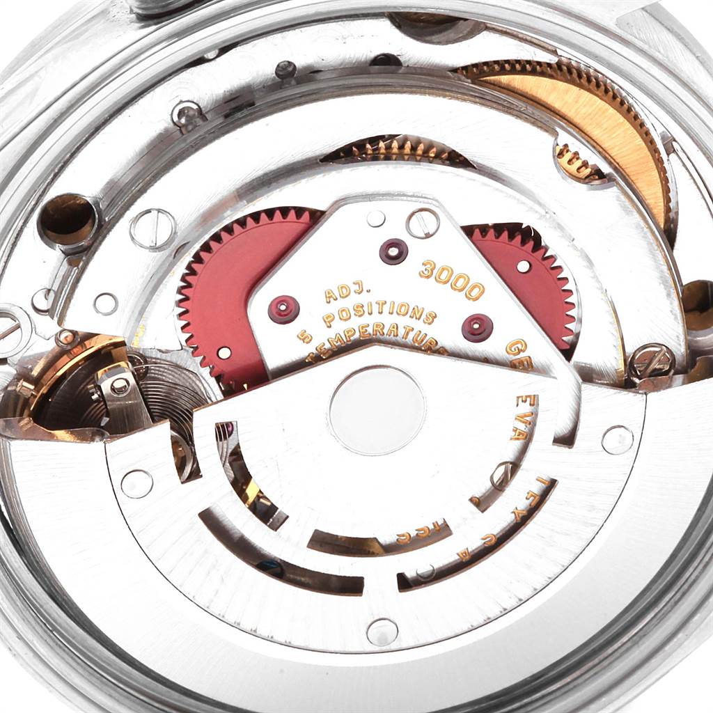 The image shows a close-up of the movement mechanism of a Rolex Air-King 14000 Men's Stainless Steel White Dial 14000 Men's Stainless Steel White Dial watch, focusing on its gears and intricate internal components.