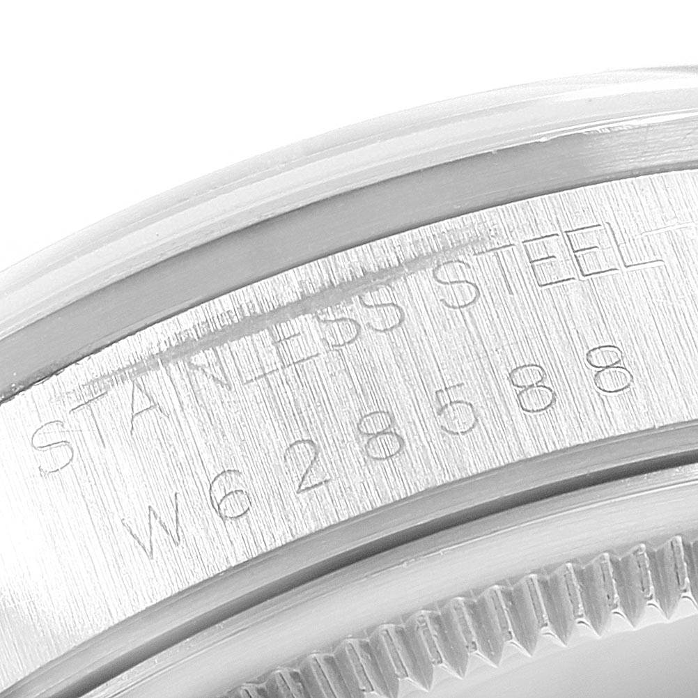 The image shows a close-up of the stainless steel case back and serial number of a Rolex Air-King 14000 Men's Stainless Steel White Dial 14000 Men's Stainless Steel White Dial watch.