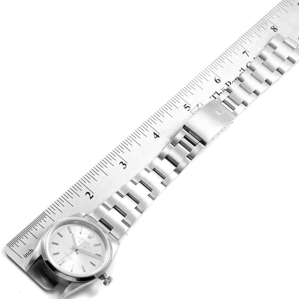 The image shows a Rolex Air-King 14000 Men's Stainless Steel Silver Dial 14000 Men's Stainless Steel Silver Dial watch laid next to a ruler, showcasing its bracelet and clasp in a top-down view.