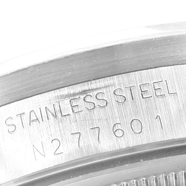 The image shows a close-up of the stainless steel case back with engraved text of the Rolex Air-King 14010 Men's Stainless Steel Blue Dial 14010 Men's Stainless Steel Blue Dial watch.