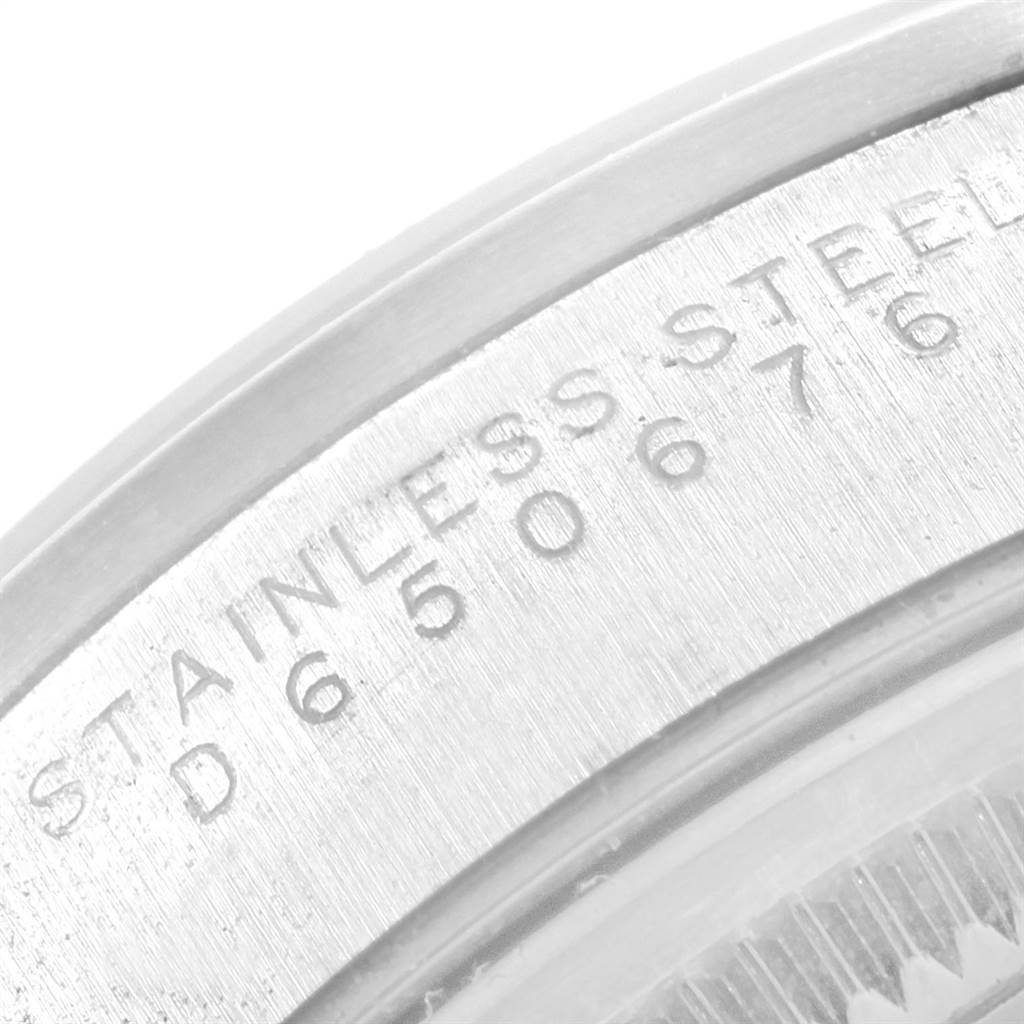 This image shows a close-up of the stainless steel casing with the serial number of a Rolex Air-King 14000 Men's Stainless Steel Black Dial 14000 Men's Stainless Steel Black Dial watch.