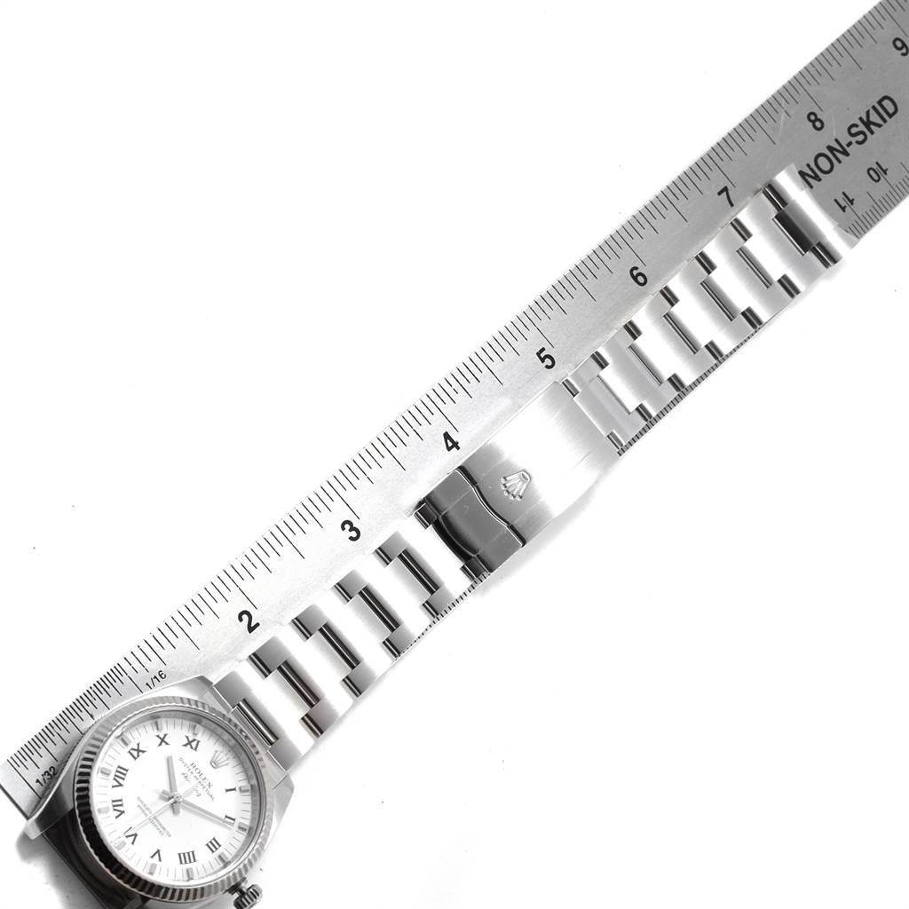 The image shows the Rolex Air-King 114234 Men's Stainless Steel White Dial 114234 Men's Stainless Steel White Dial watch positioned horizontally with a metal bracelet and clasp, measured against a ruler.