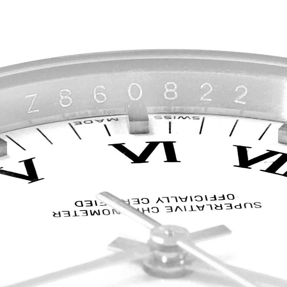 This image shows a close-up of the dial and serial number of a Rolex Air-King 114234 Men's Stainless Steel White Dial 114234 Men's Stainless Steel White Dial watch at an angled view.