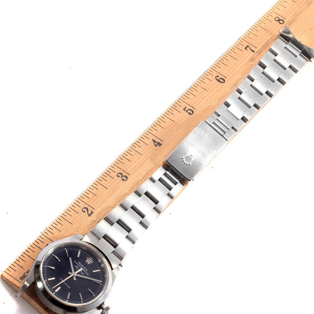 The image shows a Rolex Air-King 14000 Men's Stainless Steel Black Dial 14000 Men's Stainless Steel Black Dial watch laid flat with a ruler for size comparison, displaying its face and metal bracelet.