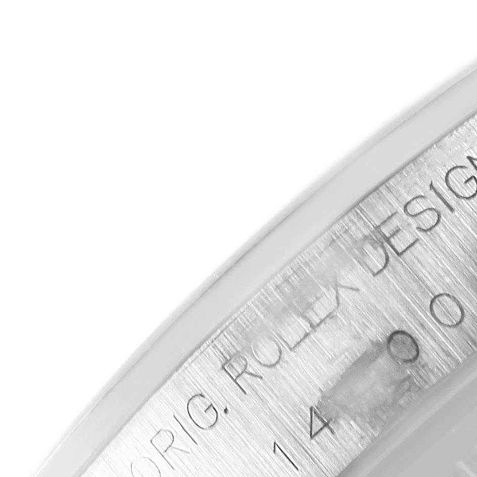 The image shows a partial engraving on the inner bezel of a Rolex Air-King 14000 Men's Stainless Steel Blue Dial 14000 Men's Stainless Steel Blue Dial watch at a close-up angle.