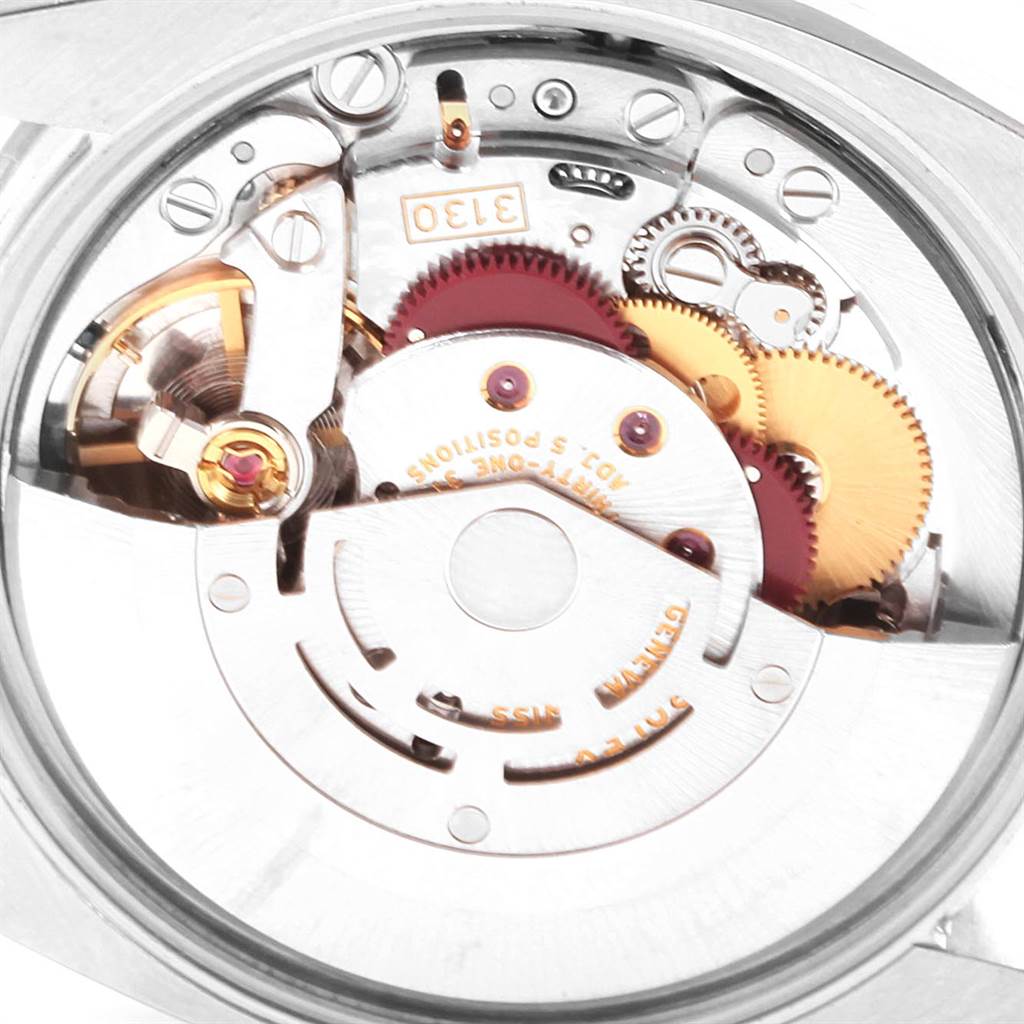 The image shows a close-up of the movement mechanism of the Rolex Air-King 114210 Men's Stainless Steel Blue Dial 114210 Men's Stainless Steel Blue Dial watch.