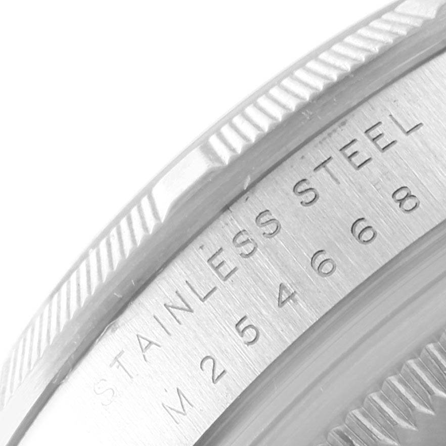 This close-up image shows the engraved stainless steel case back of a Rolex Air-King 114210 Men's Stainless Steel Blue Dial 114210 Men's Stainless Steel Blue Dial watch.