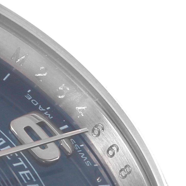 The image shows a close-up angle of the dial and bezel of a Rolex Air-King 114210 Men's Stainless Steel Blue Dial 114210 Men's Stainless Steel Blue Dial watch, focusing on the numerals and minute markers.