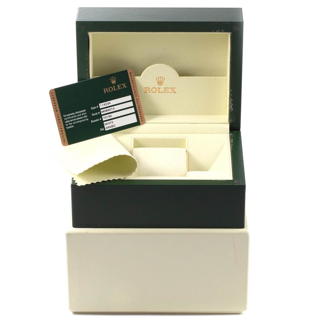 The image shows an open box for the Rolex Air-King 114234 Men's Stainless Steel White Dial 114234 Men's Stainless Steel White Dial, displaying the interior, a card, and a cloth.