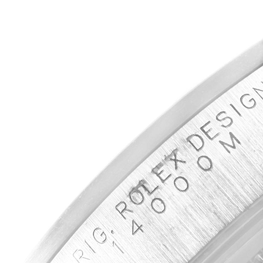 The image shows a close-up of the side of a Rolex Air-King 14000 Men's Stainless Steel Pink Dial 14000 Men's Stainless Steel Pink Dial watch, highlighting the Rolex engraving.