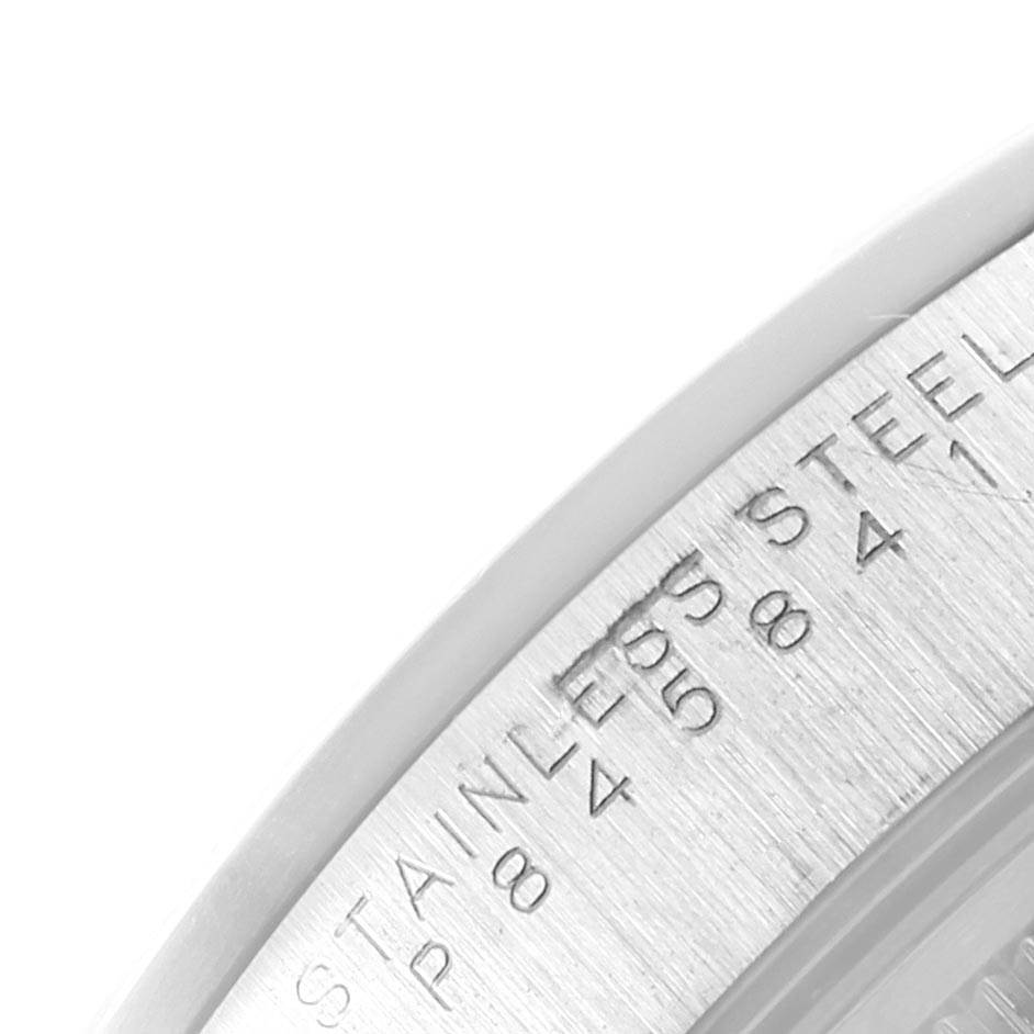 The image shows a close-up view of the stainless steel casing of a Rolex Air-King 14000 Men's Stainless Steel Pink Dial 14000 Men's Stainless Steel Pink Dial watch, highlighting text engraved on the casing.