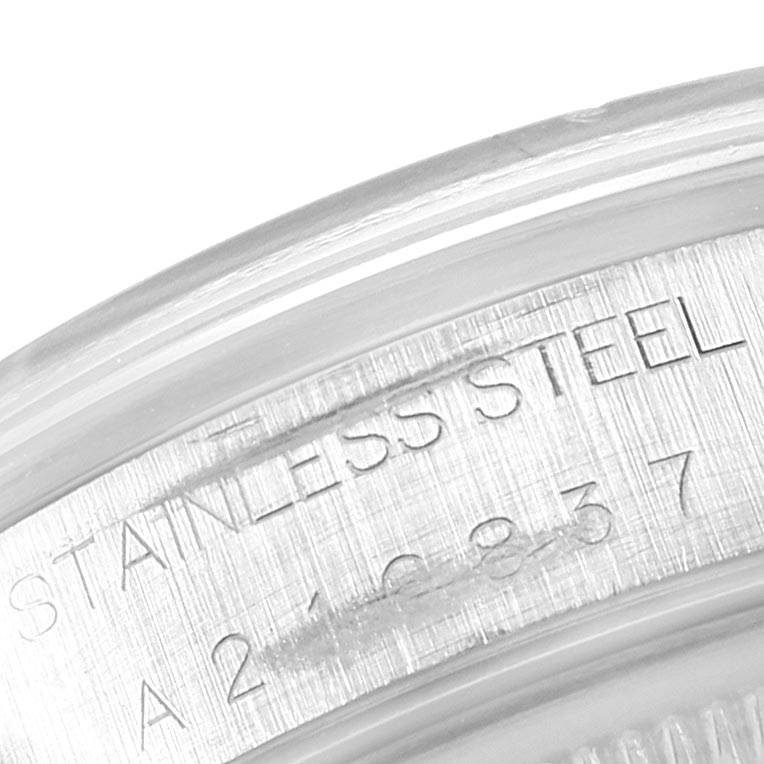This close-up image shows the engraved text on the side of a Rolex Air-King 14000 Men's Stainless Steel Blue Dial 14000 Men's Stainless Steel Blue Dial watch's stainless steel case.
