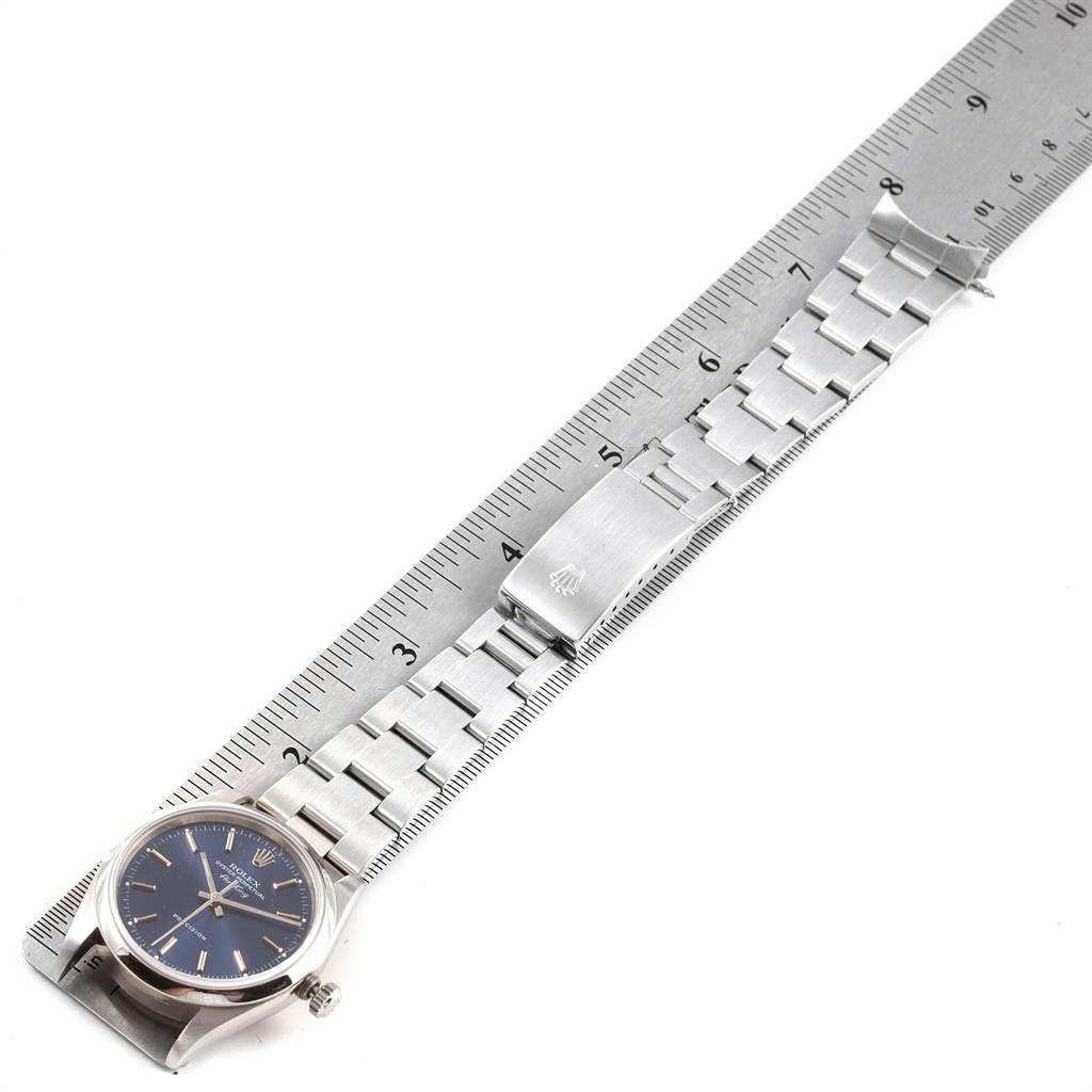 The image shows a Rolex Air-King 14000 Men's Stainless Steel Blue Dial 14000 Men's Stainless Steel Blue Dial watch laid flat next to a ruler, displaying the face and bracelet with clasp.
