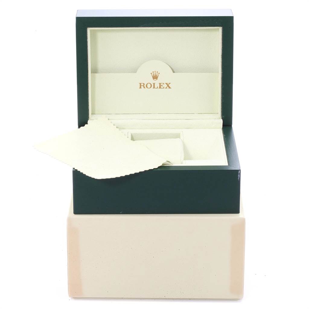 This image shows an open Rolex Air-King 114200 Men's Stainless Steel Silver Dial 114200 Men's Stainless Steel Silver Dial watch box with a cleaning cloth inside.