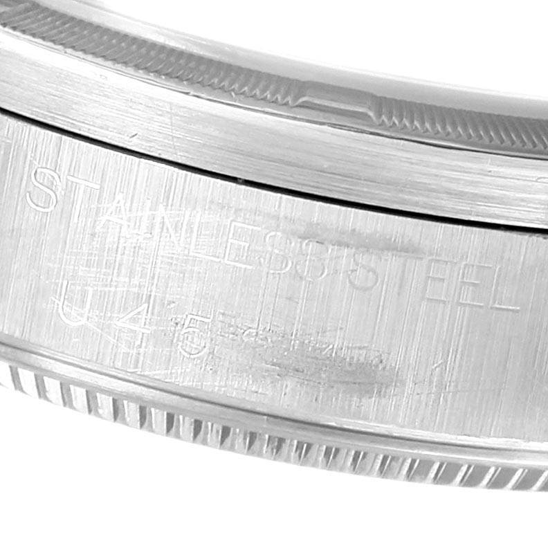 This close-up image shows the side engraving on the stainless steel case back of a Rolex Air-King 14010 Men's Stainless Steel Blue Dial 14010 Men's Stainless Steel Blue Dial watch.