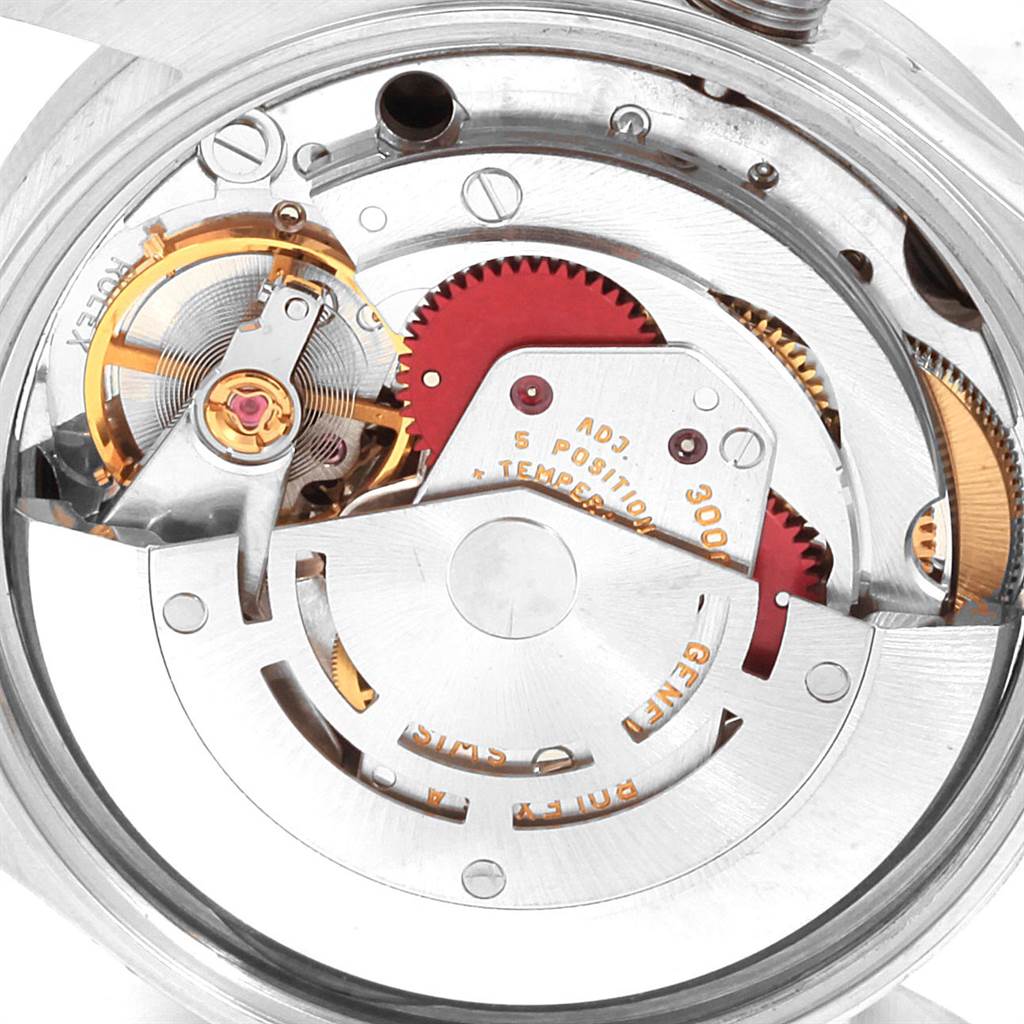 This image shows the internal mechanical movement of a Rolex Air-King 14010 Men's Stainless Steel Black Dial 14010 Men's Stainless Steel Black Dial watch, highlighting its intricate gears and components.